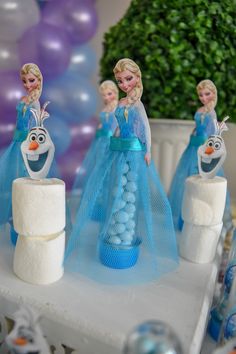 there are some cake toppers made to look like frozen princesses