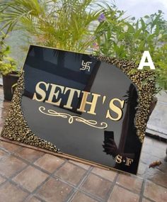 there is a sign that says seth's in gold letters on the front