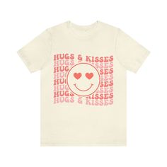 Hugs, Kisses and Smiley faces what more could you want in a retro inspired graphic tee? Perfect for valentines day! This classic unisex jersey short sleeve tee fits like a well-loved favorite. Soft cotton and quality print make users fall in love with it over and over again. These t-shirts have-ribbed knit collars to bolster shaping. The shoulders have taping for better fit over time. Dual side seams hold the garment's shape for longer.  .: 100% Airlume combed and ringspun cotton (fiber content Hugs Kisses, Smiley Faces, Hugs And Kisses, Jersey Tee, Shirt Price, Retro Inspired, Jersey Shorts, Cotton Fiber, Smiley