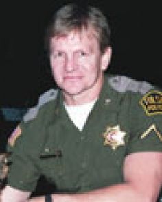 a man in uniform sitting at a table