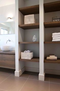 the bathroom is clean and ready to be used as a storage area for towels or other items