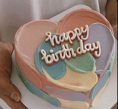 a heart shaped cake with the words happy birthday written on it