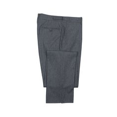 For those who prefer to go sans belt, these wool trousers are cut in a slim pattern with higher rise and side adjusters. Cut from a soft medium weight flannel cloth, they feature an extended waistband closure, shirt-stripe lining among numerous thoughtful details. Details 100% wool, 340g weight Flat front, tapered leg, lined to the knee Three point closure with extended waistband, side tabs, no belt loops Waistband and pocketing in traditional striped oxford cotton shirting Unhemmed leg opening Mens Trousers Fashion, Flannel Trousers, Umbrella Shop, Grey Flannel, Wool Flannel, Wool Trousers, Well Dressed Men, Trouser Suits, Mens Trousers