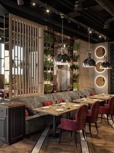 an image of a restaurant setting with wooden tables and red velvet chairs in the middle