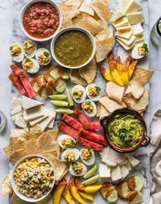 a table topped with different types of food and condiments on top of it