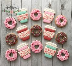 decorated donuts and cupcakes are arranged on a wooden table with the words i love coffee