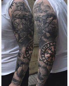 two men with tattoos on their arms