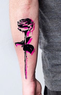 a person with a tattoo on their arm holding a flower in one hand and a knife in the other