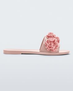 Side view of a pink Babe Springtime women's slide with 3 pink flowers. Pink Spring Poolside Sandals, Pink Sandals For Spring Poolside, Pink Sandals For Poolside Spring, Trendy Flower Sandals For Beach, Chic Poolside Sandals For Spring, Spring Adjustable Slides For Poolside, Adjustable Slides For Spring Poolside, Adjustable Slides For Poolside Spring, Adjustable Sandals For Pool And Spring Season