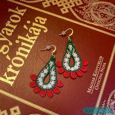 Pay a tribute to your Hungarian heritage with these beautiful handmade embroidered lace earrings by JOHANNIKA. Our intricate teardrop earrings come with silver plated ear wires and plastic backings for added safety. They are lightweight and sure to complement your outfit. Wear them with a casual, modern attire just for fun, or save them for that special event! Our jewelry can be hand washed, if necessary. These JOHANNIKA Hungarian tricolor earrings come beautifully wrapped and can include a spec Traditional Handmade Teardrop Earrings For Gift, Traditional Embroidered Drop Earrings, Traditional Handmade Christmas Jewelry, Floral Nursery Decor, Flower Mobile, Lace Necklace, Lace Earrings