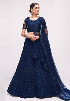 Net a line lehenga choli in Navy blue colour 1068C  Desc:  Style : A Line Lehenga Choli Color : Navy Blue Fabric : Net Work : Embroidery Wash Care : Dry clean Sleeve Style : Half Sleeve Long Sleeves : Done only in Custom Stitch Sleeves Lining : Done only in Custom Stitch Bust Size : 32 to 42 Inches Occasion : Wedding   Mehendi   Sangeet   Engagement   Reception   Ceremonial   Baby Shower. With Express Free Shipping and Custom Stitching, Buy Indian Party wedding wear bridal Lehenga Net a line leh Luxury Royal Blue Choli With Resham Embroidery, Luxury Royal Blue Floor-length Lehenga, Blue Designer Lehenga, Dark Blue Lehenga, Navy Blue Lehenga, A Line Lehenga, Dark Blue Blouse, Bridesmaid Lehenga, Net Blouses