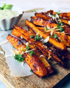 some food is sitting on a cutting board and ready to be eaten