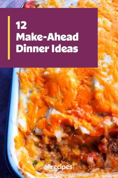 a casserole dish with cheese and meat in it on a blue table cloth