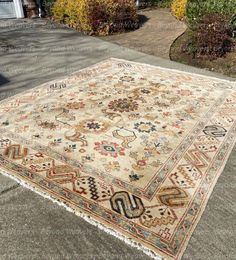 an old rug is laying on the ground