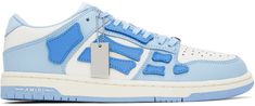 Low-top paneled buffed and grained leather sneakers in white and blue. Leather graphic appliqués throughout. · Perforated detailing at round toe · Logo plaque at lace-up closure · Leather logo patch at padded tongue and heel · Padded collar · Mesh lining · Logo embossed at textured rubber midsole · Treaded rubber outsole Supplier color: Blue Blue Amiri Shoes, Cute Sneakers, Shoe Boutique, Low Sneakers, Leather Logo, Blue Leather, Luxury Streetwear, Leather Sneakers, Low Top