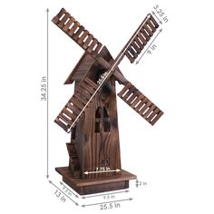 a wooden windmill is shown with measurements