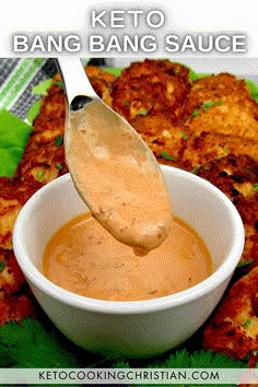 a spoon full of keto bang sauce on top of some fried food