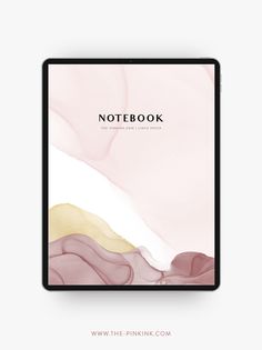 the pink and gold notebook is open on top of a white background with an abstract design