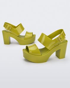 Trendy Heels With Heel Strap, Modern Spring Heels, Trendy Heels With Sculpted Heel, Trendy Green Heels With Heel Strap, Trendy Heels With Translucent Outsole And Open Heel, Modern High Heel With Translucent Outsole, Modern Green Ankle Strap Heels, Modern Green Heels For Summer, Modern Green Heels