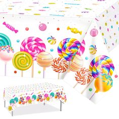 the table cloth is decorated with colorful lollipops and candy canes on it