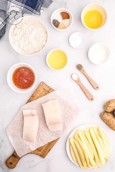 the ingredients for this recipe are laid out on a cutting board, including potatoes, eggs, and butter