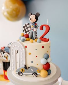 a mickey mouse birthday cake with the number two on it