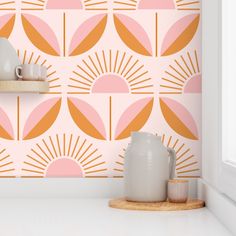 the wallpaper in this kitchen is pink and orange