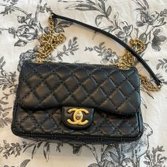 Quilted Lambskin With Mini Gold Stud Detail Gold Chain With Leather Strap Deep Midnight Blue Base Length: 9 In Height: 5.75 In Width: 2.5 In Drop: 9.25 In Drop: 17 In Certificate Of Authenticity Beautiful Condition Chic Flap Bag With Cc Turnlock Closure For Shopping, Chic Flap Bag With Cc Turnlock For Shopping, Gold Shoulder Bag With Cc Turnlock For Evening, Gold Double Flap Evening Bag, Evening Flap Bag With Soft Leather And Double Flap, Soft Leather Double Flap Evening Bag, Gold Shoulder Bag With Cc Turnlock Closure For Evening, Elegant Evening Bags With Cc Turnlock Closure, Luxury Evening Double Flap Shoulder Bag