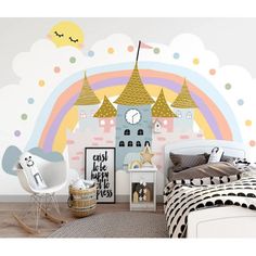 a child's bedroom with a castle mural and rainbow wall decals on the walls