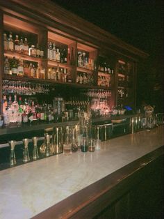 the bar is full of liquor bottles and glasses