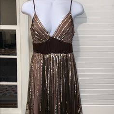 Beautiful Coffee Colored Mid Length Cocktail Dress. Has Pink/Beige Beading All Around Which Gives It A Shimmer Effect. Peep Hole Design On The Back With A Satin Bow. Spaghetti Straps Which Are Adjustable. Low Cut Bust Line In Front. Zipper Closure On The Side. Tags Were Removed But It’s A Size 4. Some Threading Came Loose And There Are Minimal Pulls Here And There On The Fabric But Nothing Overly Noticeable. Adriana Papell Dress, Dusty Pink Bridesmaid Dresses, Evening Cocktail Dress, Cocktail Dress Holiday, Beaded Party Dress, Tulle Evening Dress, Prom Dresses Gowns, Formal Dresses Gowns, Sequin Cocktail Dress