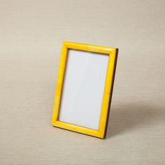 a yellow frame sitting on top of a table