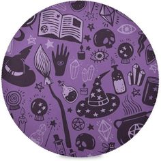 a purple and black pattern on a round surface with an image of witches, books, and other things