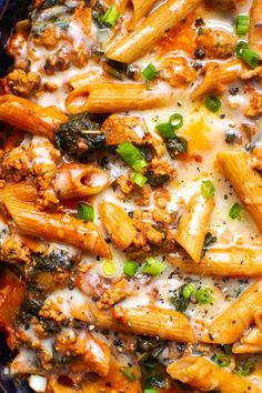 pasta with meat, cheese and green onions in a skillet