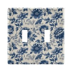 a blue and white flowered light switch cover