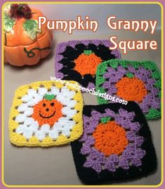 four square crocheted pumpkin grannys on a table next to a small pumpkin