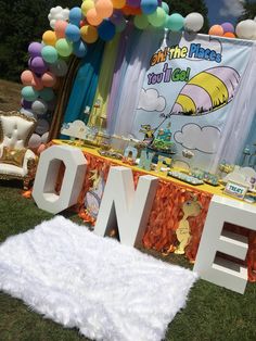 a dr seuss themed birthday party with balloons and decorations