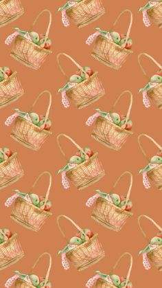 an image of a basket with apples and cherries in it on a pink background