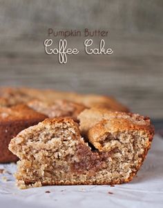 a muffin cut in half sitting on top of a piece of paper