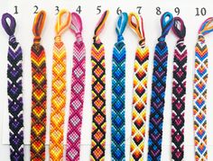 six different colored bracelets with numbers on them