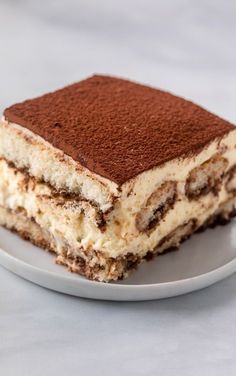 a piece of cake sitting on top of a white plate