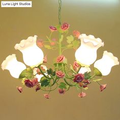 a chandelier with flowers hanging from it