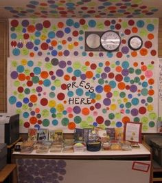 the wall is decorated with colorful circles