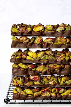 chocolate covered donuts stacked on top of each other