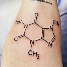 a tattoo on the arm of a person with chemical symbols