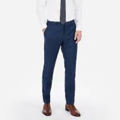 This Slim Navy Suit Pant Is Made From A Breakthrough Stretch Fabric That Moves With You And Keeps Its Shape. They're A Game-Changing Choice For Short Commutes, Cross-Country Flights And Everywhere In-Between. Lightweight Seasonless Fabric Slim Fit, Sits Below Waist, Straight Narrow Leg Button Closure With Zip Fly Dry Clean; Imported Deep Slant Hand Pockets, Buttoned Back Pockets Matching Jacket Style #6071560 Virgin Wool/Polyester/Elastane Slim Fit Business Trousers, Business Slim Fit Trousers, Slim Fit Tapered Leg Business Bottoms, Business Slim Fit Tapered Leg Bottoms, Semi-formal Slim Fit Straight Leg Bottoms, Blue Slim Fit Casual Pants, Casual Slim Fit Blue Bottoms, Casual Blue Slim Fit Pants, Business Bottoms With Pockets