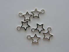 14 Star charms 10 x 12mm Double sided Lead free, nickel safe and cadmium free zinc alloy Cord Bracelets, Star Charms, Zinc Alloy, Antique Silver, Silver Plate, 50 %, Really Cool Stuff, Plating, Stars