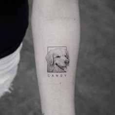 a person with a dog's face tattooed on their arm and the word candy written in black ink