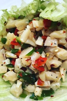 lettuce and chicken salad on a white plate