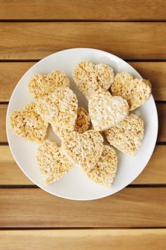 some rice krispy treats are on a white plate